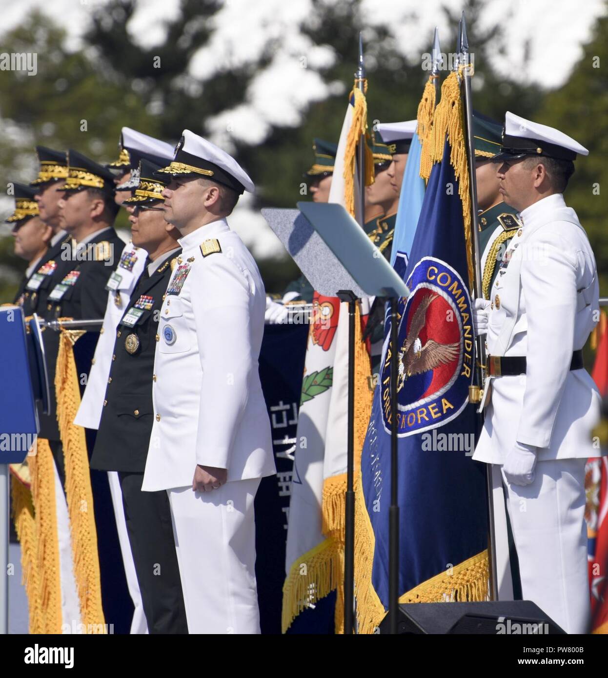 PYEONGTAEK, Republic of Korea (Sept. 28, 2017) Republic of Korea (ROK) Rear Adm. Brad Cooper, commander, Naval Forces Korea (CNFK) and Master Chief Chris Stone, CNFK command master chief, stand during the 69th annual ROK Armed Forces Day Ceremony. Armed Forces Day comemmorates the service of men and women in the ROK armed forces, the day that South Korea broke through the 38th parallel during the Korean War in 1950. Cooper is also presented the Presidential Unit Citation by ROK President Moon, Jae-in, this is the first time a U.S. Navy command is presented this award since the end of the Korea Stock Photo