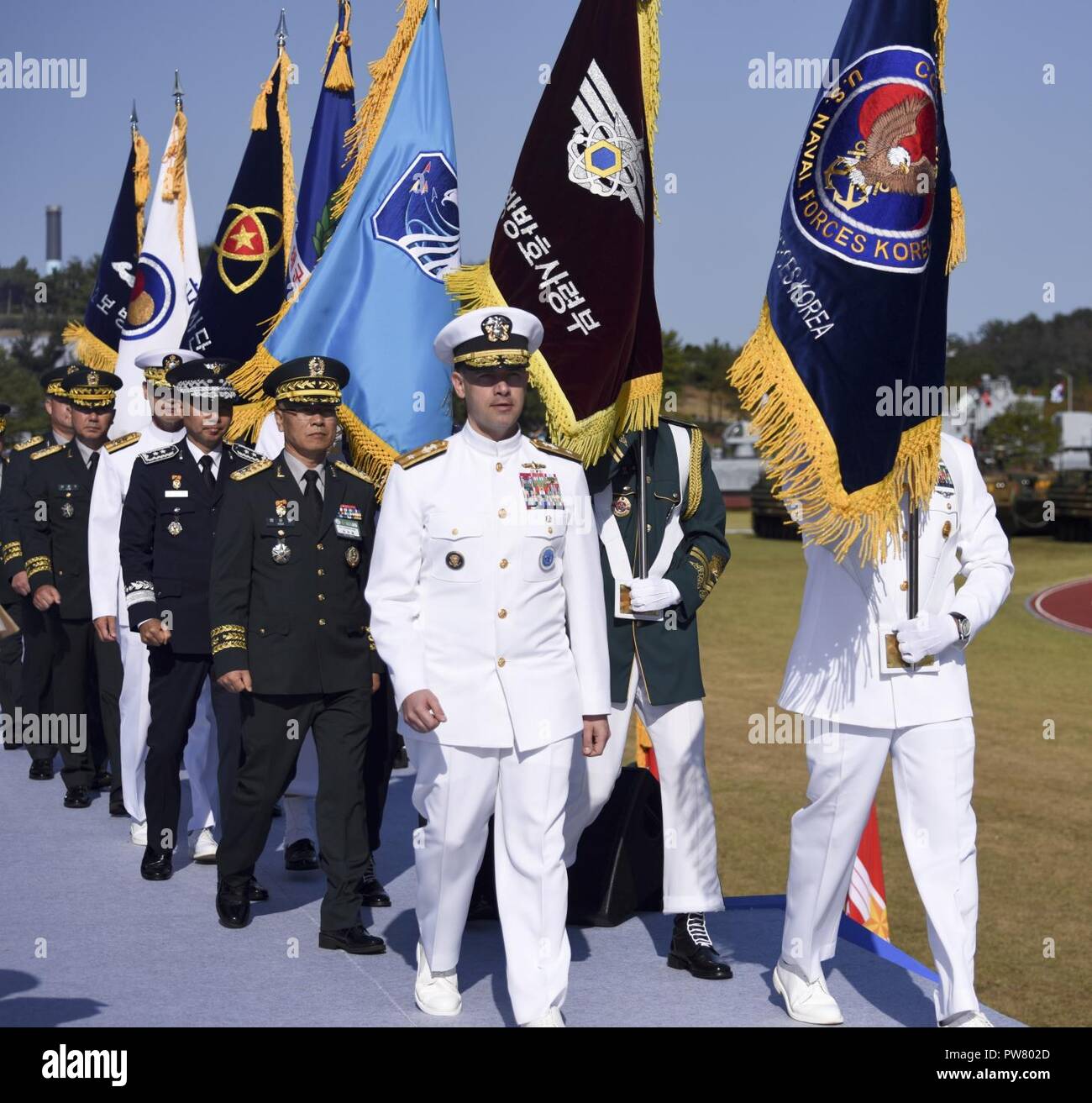 PYEONGTAEK, Republic of Korea (Sept. 28, 2017) Rear Adm. Brad Cooper, commander, Naval Forces Korea (CNFK), marches to the award stage during the 69th annual Republic of Korea (ROK) Armed Forces Day Ceremony. Armed Forces Day comemmorates the service of men and women in the ROK armed forces, the day that South Korea broke through the 38th parallel during the Korean War in 1950. Cooper is also presented the Presidential Unit Citation by ROK President Moon, Jae-in, this is the first time a U.S. Navy command is presented this award since the end of the Korean War. Stock Photo