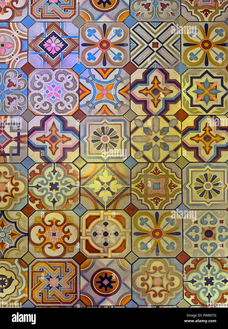 Multicolored patterned tile floor in restaurant, Spain Stock Photo