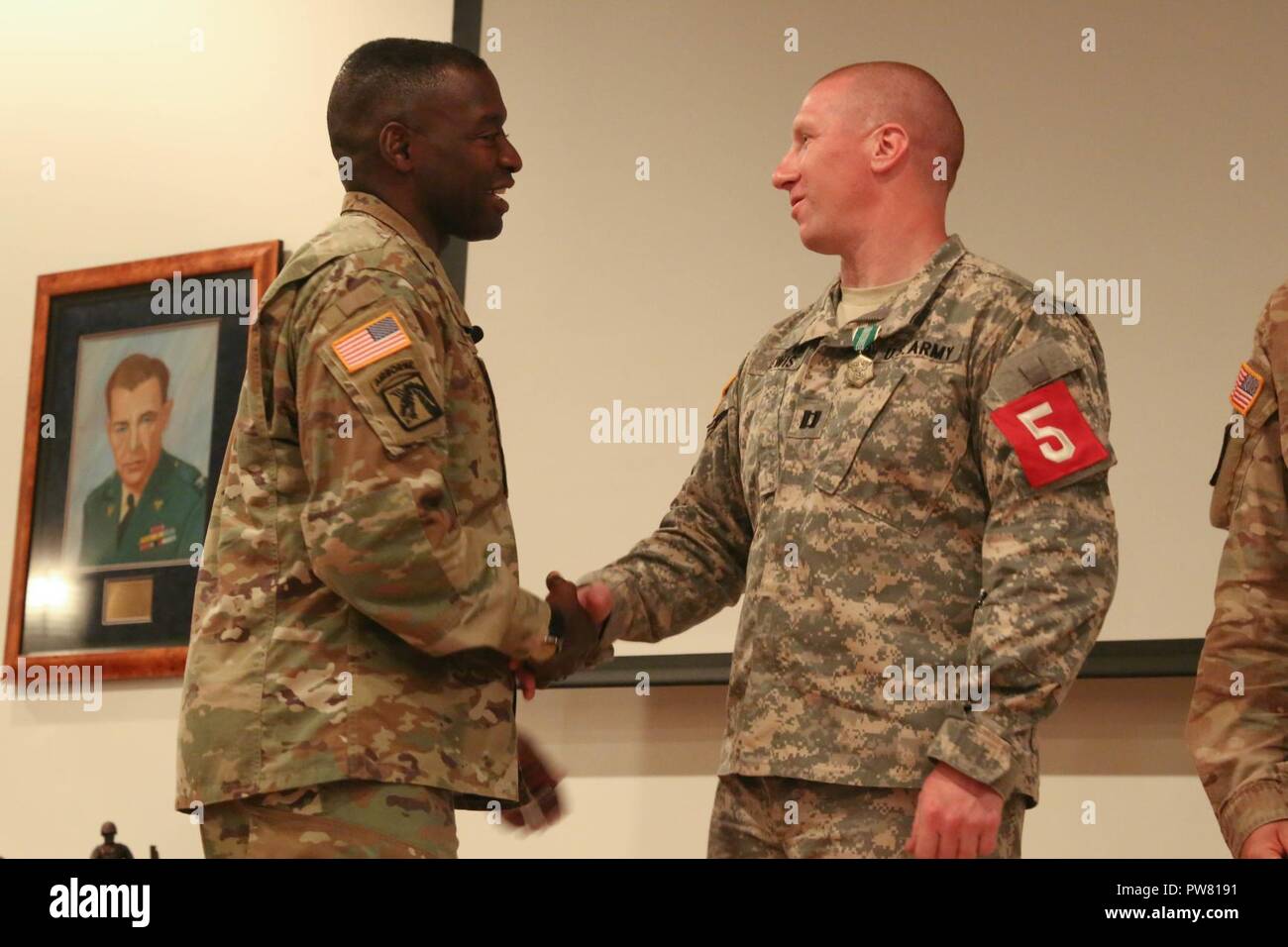 U.S. Army Brig. Gen. R. Scott Dingle of the Regional Health Command - Atlantic, congratulates Capt. Jeremy Lewis after winning the 2017 Best Medic Competition at Fort Bragg, N.C., Sept. 20, 2017. The competition tested the physical and mental toughness, as well as the technical competence, of each medic to identify the team moving forward to represent the region at the next level of the competition. Stock Photo