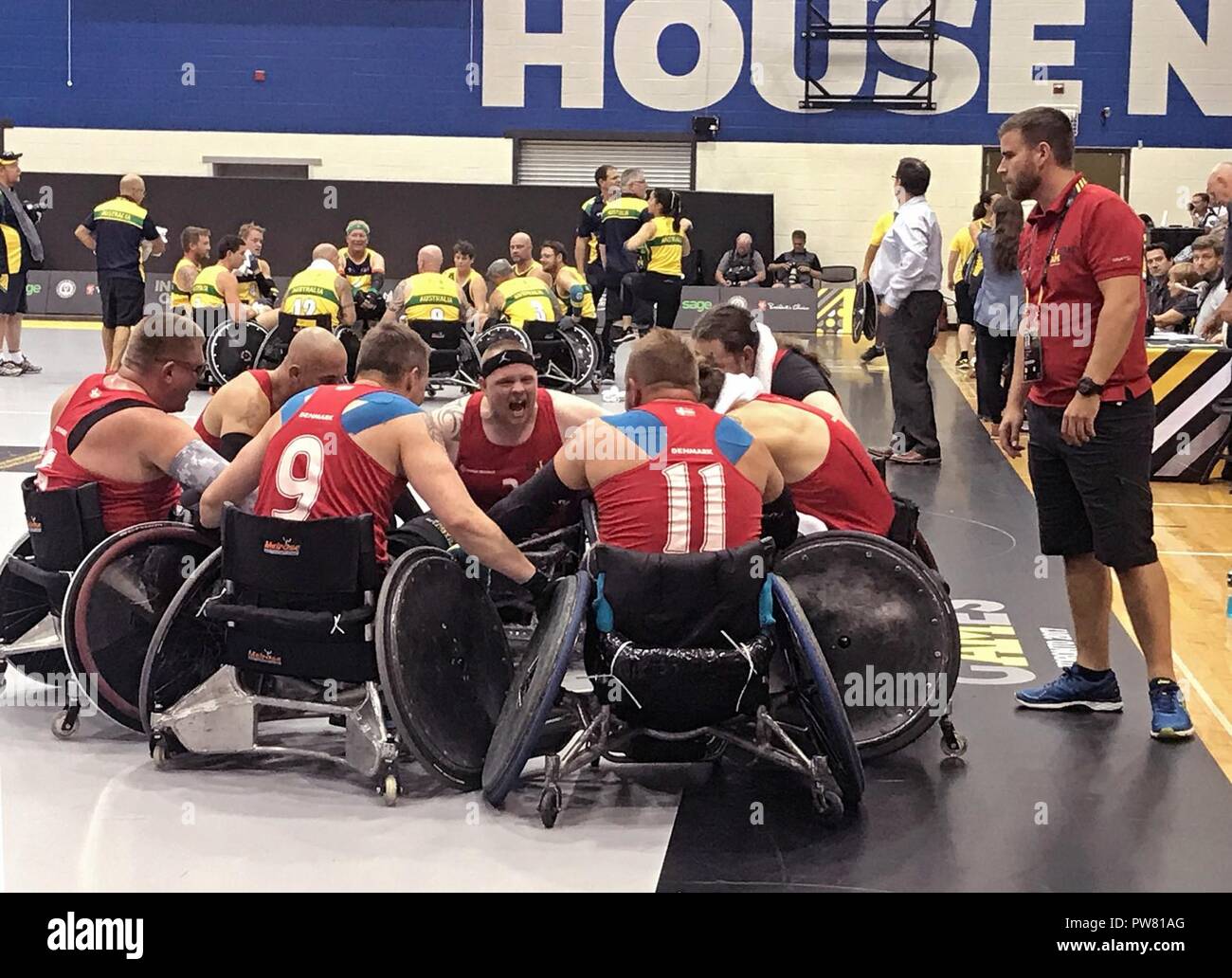 Danish Army Cpl. Mark Peters leads the Denmark rugby team in a victory  cheer after defeating Australia in a wheelchair rugby matchup in pool play  at the Mattamy Athletics Center during the