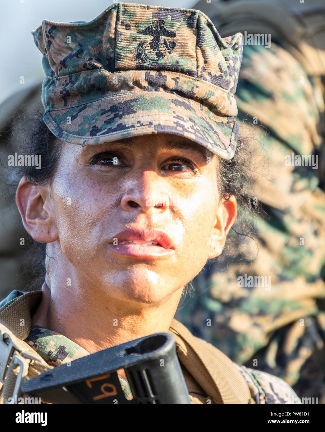 Camp Pendleton (September 29, 2017) Chief Warrant Officer Three Serena M. Tricea an intelligence master analyst with the 11th Marine Expeditionary Unit, participates in a conditioning hike on Camp Pendleton, California. The purpose of the conditioning hike is to target key areas, which are involved with propelling the body forward while also improving cardiovascular fitness, endurance, flexibility, strength and most importantly unit cohesion. Stock Photo