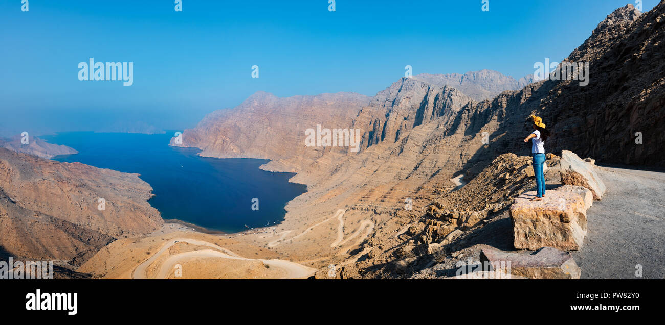 Woman enjoying view over Fjord Khor Najd in Musandam Oman Stock Photo