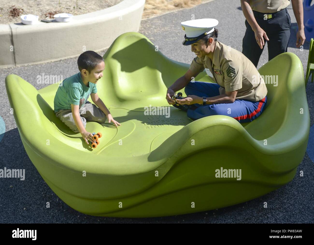SAN FRANCISCO (Oct. 3, 2017) Marine Staff Sgt. Erika Gongora plays with a patient at University of California San Francisco Benioff Children’s Hospital during a Fleet Week San Francisco community outreach event. Fleet Week provides an opportunity for the American public to meet their Navy, Marine Corps, and Coast Guard team and to experience America's sea services. Fleet Week San Francisco will highlight naval personnel, equipment, technology and capabilities, with an emphasis on humanitarian assistance and disaster response. Stock Photo