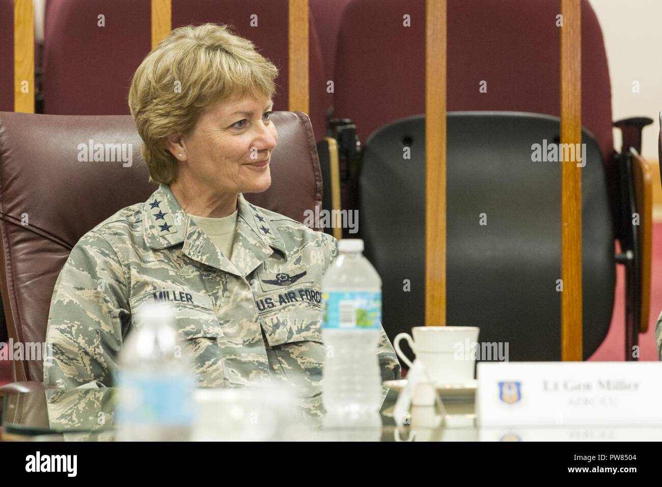 Lt. Gen. Maryanne Miller, Commander Air Force Reserve Command and Chief of the Air Force Reserve, Robins Air Force Base, Georgia, listens to a briefing by Col. David Garfield, Commander, 482nd Fighter Wing during a visit Homestead Air Reserve Base, Florida, October 3, 2017. Lt. Gen. Maryanne Miller, Maj. Gen. Kenneth Lewis and Chief Master Sgt. Ericka Kelly visited the 482nd Fighter Wing to inspect damage and repairs that are being made after the base had been hit Hurricane Irma on September 10, 2017. Stock Photo