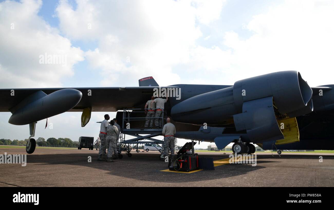 Maintainers from the 96th Aircraft Maintenance Unit remove a panel from a B-52 Stratofortress while deployed to RAF Fairford, United Kingdom, Sept. 26, 2017. The deployment of strategic bombers to the United Kingdom helps exercise RAF Fairford as U.S. Air Forces in Europe’s forward operating location for bombers. The deployment will also include joint and allied training to improve bomber interoperability. Training with joint partners, allied nations and other U.S. Air Force units contributes to our ready and postured forces and enables us to build enduring and strategic relationships necessar Stock Photo