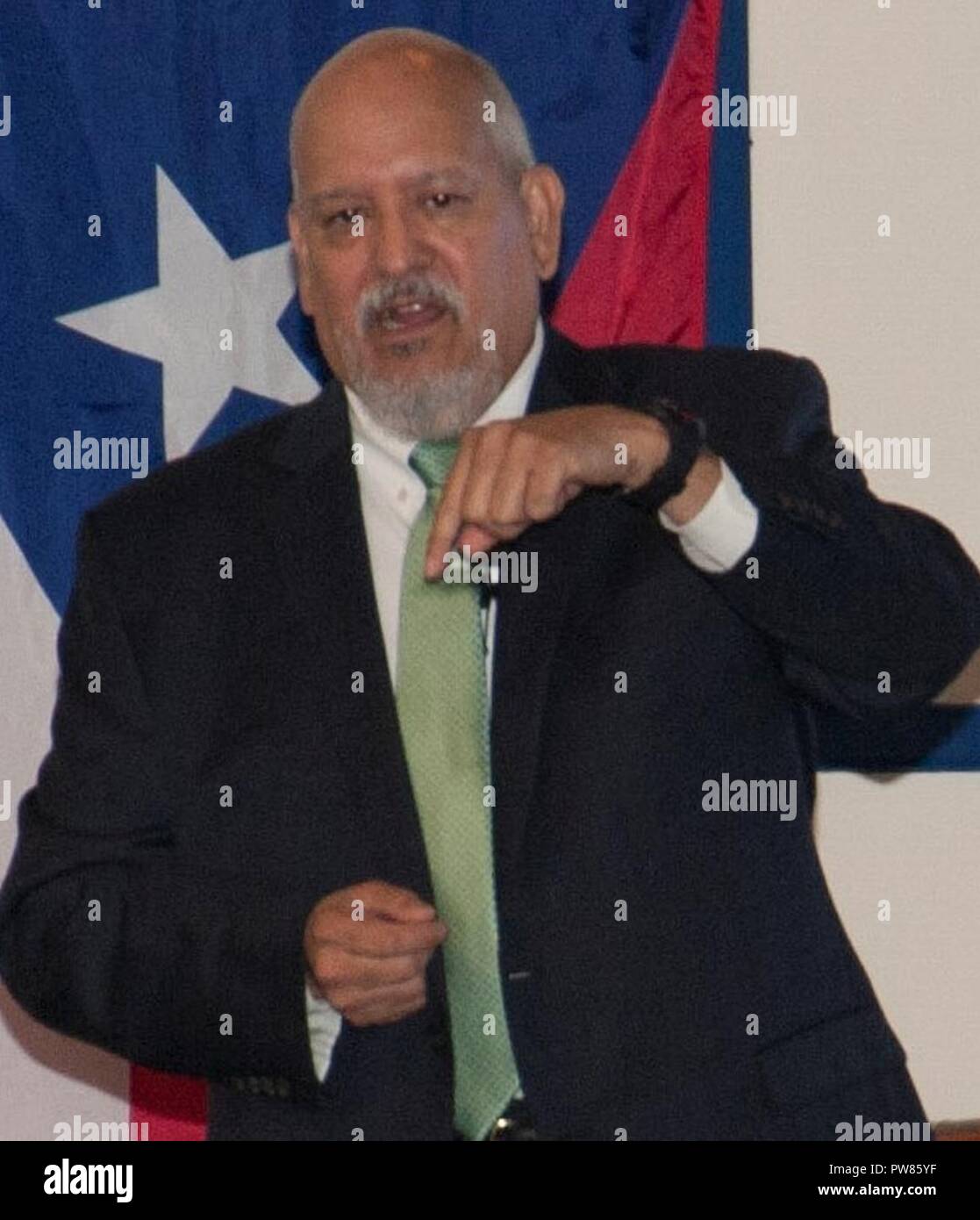 DAHLGREN, Va. (Sept. 28, 2017) - Hispanic Heritage Observance keynote speaker Lance Carrington encourages his audience to pray for the residents of Puerto Rico after Hurricane Maria devastated the island, and to pray for those living in Texas, the Gulf Coast, and Florida who are recovering from Hurricanes Harvey and Irma. Carrington – retired from the Senior Executive Service (SES) as a special agent for NASA and the U.S. Postal Service – recounted his life and career which included service in the Army as a reserve chief warrant officer. He retired from the Army reserves on Oct. 1, 2017 after  Stock Photo