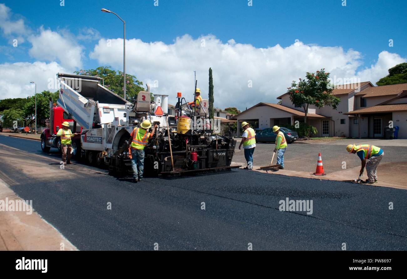 WHEELER ARMY AIRFIELD — Laborers with Grace Pacific LLC, work on repaving Lauhala Road near the Wili Wili neighborhood at Wheeler Army Airfield, Sept. 27, 2017. Stock Photo