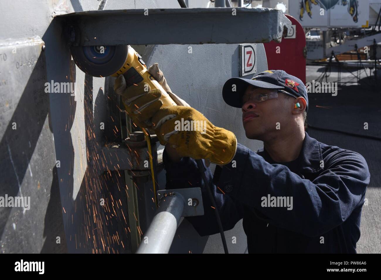 NORFOLK (Oct. 3, 2017) Fireman Jamarcus Saffo grinds a holdback device