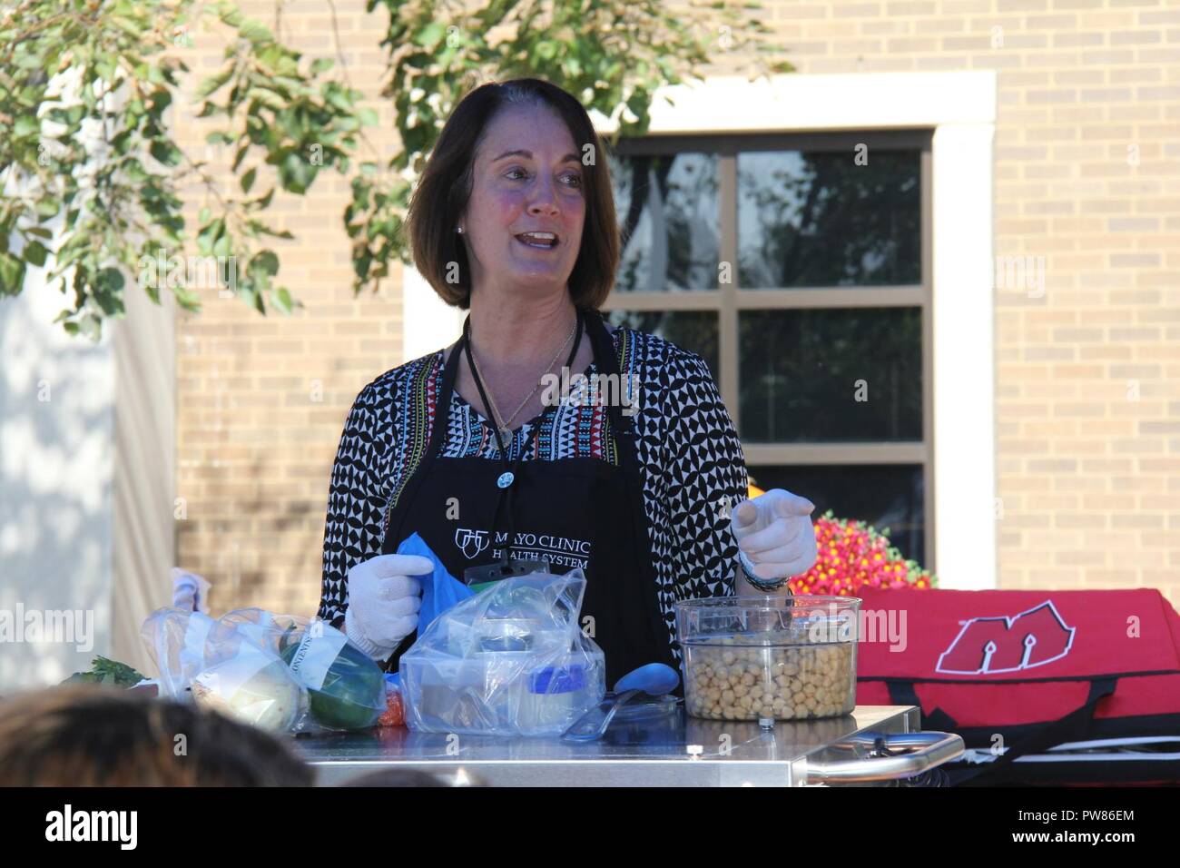 Lynn Edwards, registered dietitian nutritionist and certified dietitian with Morrison Healthcare, contracted through Mayo Clinic Health System, prepares hummus during a cooking demonstration Sept. 19, 2017, outside building 2187 at Fort McCoy, Wis. The demonstration was organized by the Civilian Personnel Advisory Center Wellness Committee, which promotes and encourages healthy lifestyles. Events are held on a regular basis throughout the year, including runs/walks, guest speakers, CPAC Wellness Challenge, and Salad Club. Stock Photo