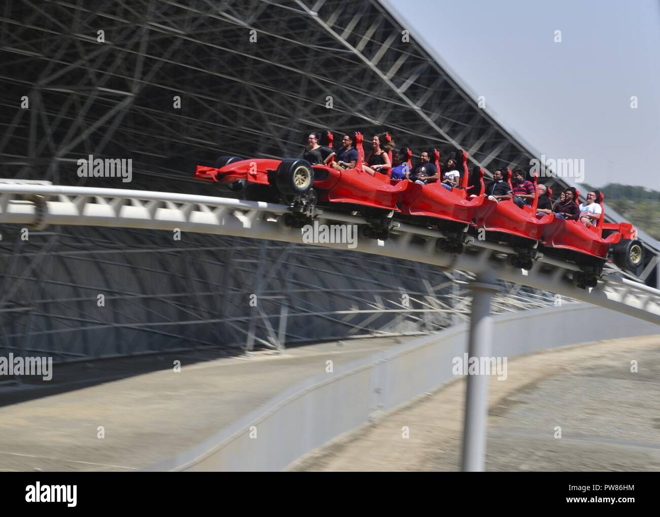 DUBAI, United Arab Emirates (Sept. 28, 2017) U.S. Navy Sailors assigned to the aircraft carrier USS Nimitz (CVN 68) enjoy a roller coaster ride at Ferrari World during a tour coordinated through Morale, Welfare, Recreation (MWR) in Dubai, United Arab Emirates, Sept. 28. Nimitz is deployed in the U.S. 5th Fleet area of operations in support of Operation Inherent Resolve. While in this region, the ship and strike group are conducting maritime security operations to reassure allies and partners, preserve freedom of navigation, and maintain the free flow of commerce. Stock Photo