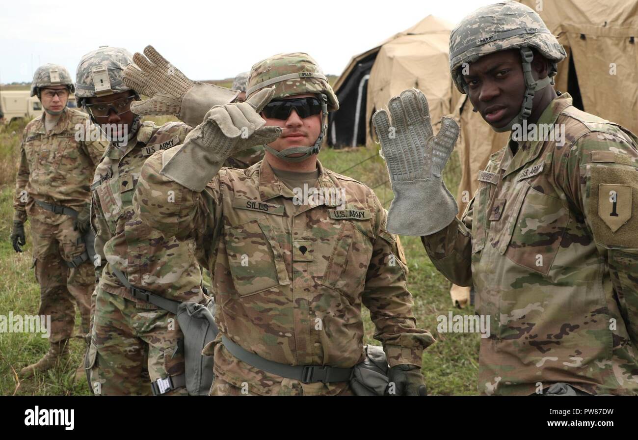 First Infantry Division Sustainment Brigade Soldiers try on protective ...