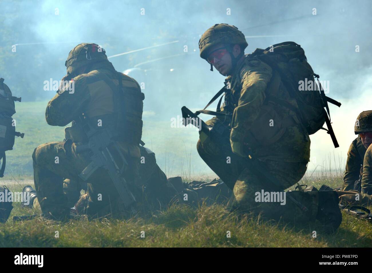 Multinational soldiers participate in the Tactical Combat Casualty Care medical training exercise, hosted by the International Special Training Center, Pfullendorf, Germany, 27 September, 2017. Training exercises such as this are an invaluable method of enhancing NATO partnered nations to maintain a stong allied force against the global war on terrorism. Stock Photo