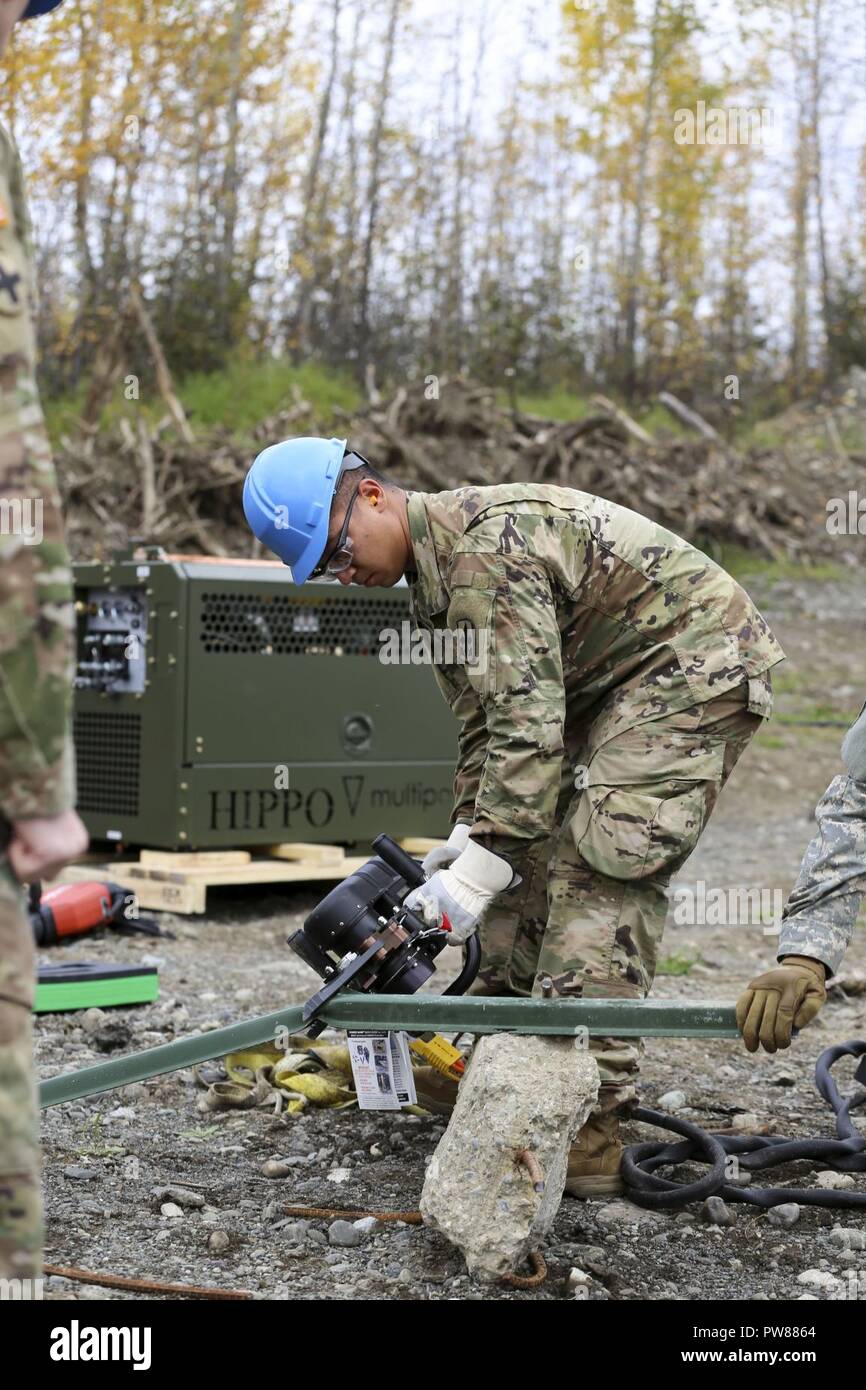 alaska-army-national-guard-sgt-kin-shaw-a-wheeled-vehicle-mechanic-with-the-297th-forward-support-company-and-maintainer-for-the-combined-support-maintenance-shop-participates-in-a-field-demonstration-using-the