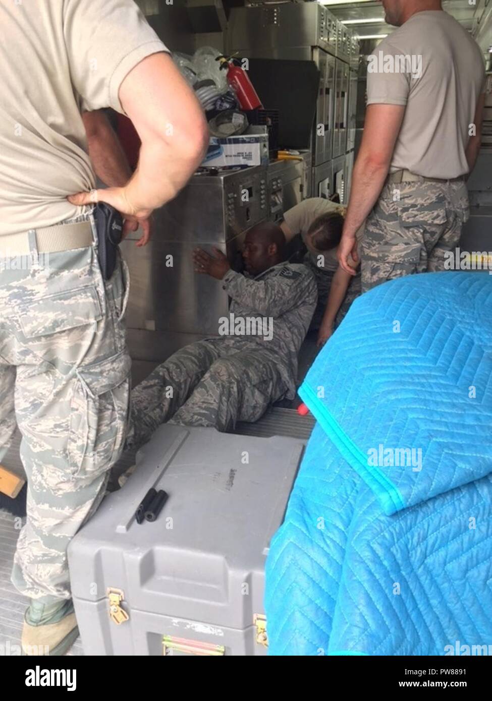 The 179th Airlift Wing along with Airmen from the 178th Wing, Springfield, Ohio, respond to relief efforts needed in Puerto Rico October 4, 2017. The 179th AW sends one of its C-130H Hercules loaded with a Disaster Relief Mobile Kitchen Trailer (DRMKT) with services Airmen from both units. Airmen from both units will use the extremely flexible DRMKT, which supports virtually any field-feeding scenario, form quickly prepared boil-in-the-bag meals to restaurant-quality meals for up to 1,000 people in under 90 minutes. The 179th AW is always ready to respond with a team of trusted Airmen for stat Stock Photo