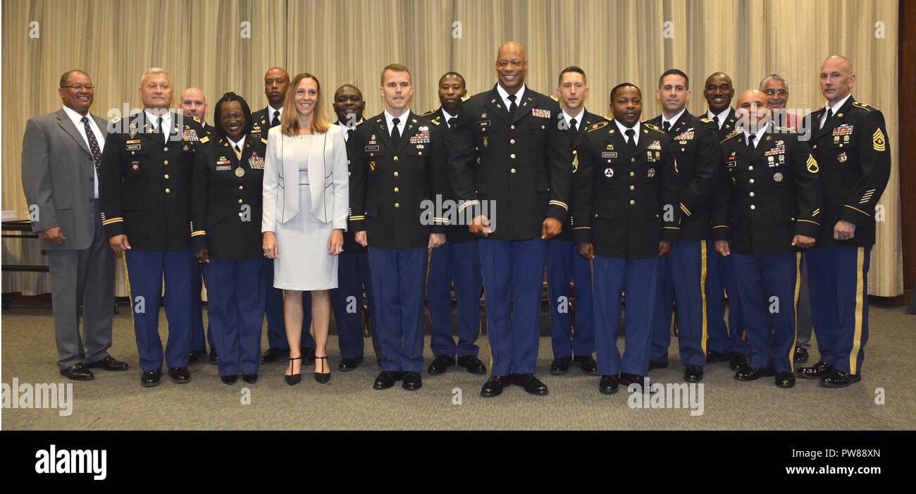 Army Logistics University distinguished instructor honorees pose with members of the ALU command team after receiving recognition at a ceremony held in September 2017. Two of the honorees, Chaplain (Maj.) Vincent T. Myers, Staff and Faulty Department, and Chief Warrant Officer 3 Truman V. Ward, Technical Logistics College, both pictured center, front row, went on to win the Training and Doctrine Command officer and warrant officer instructor of the year titles, respectively. Myers has since relocated to another installation. Stock Photo