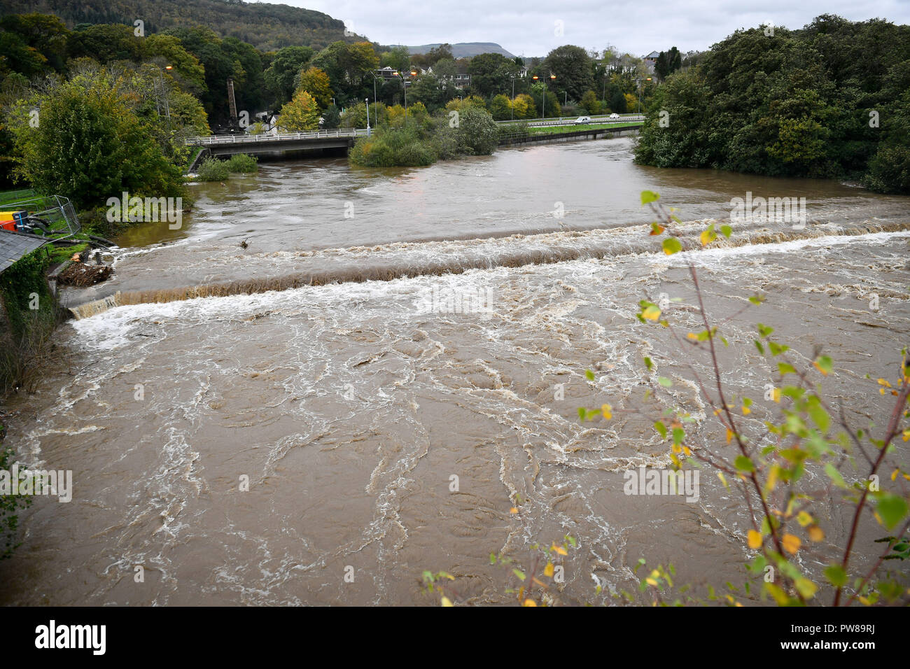 The River Neath weir near Aberdulais, Neath, South Wales, covered in