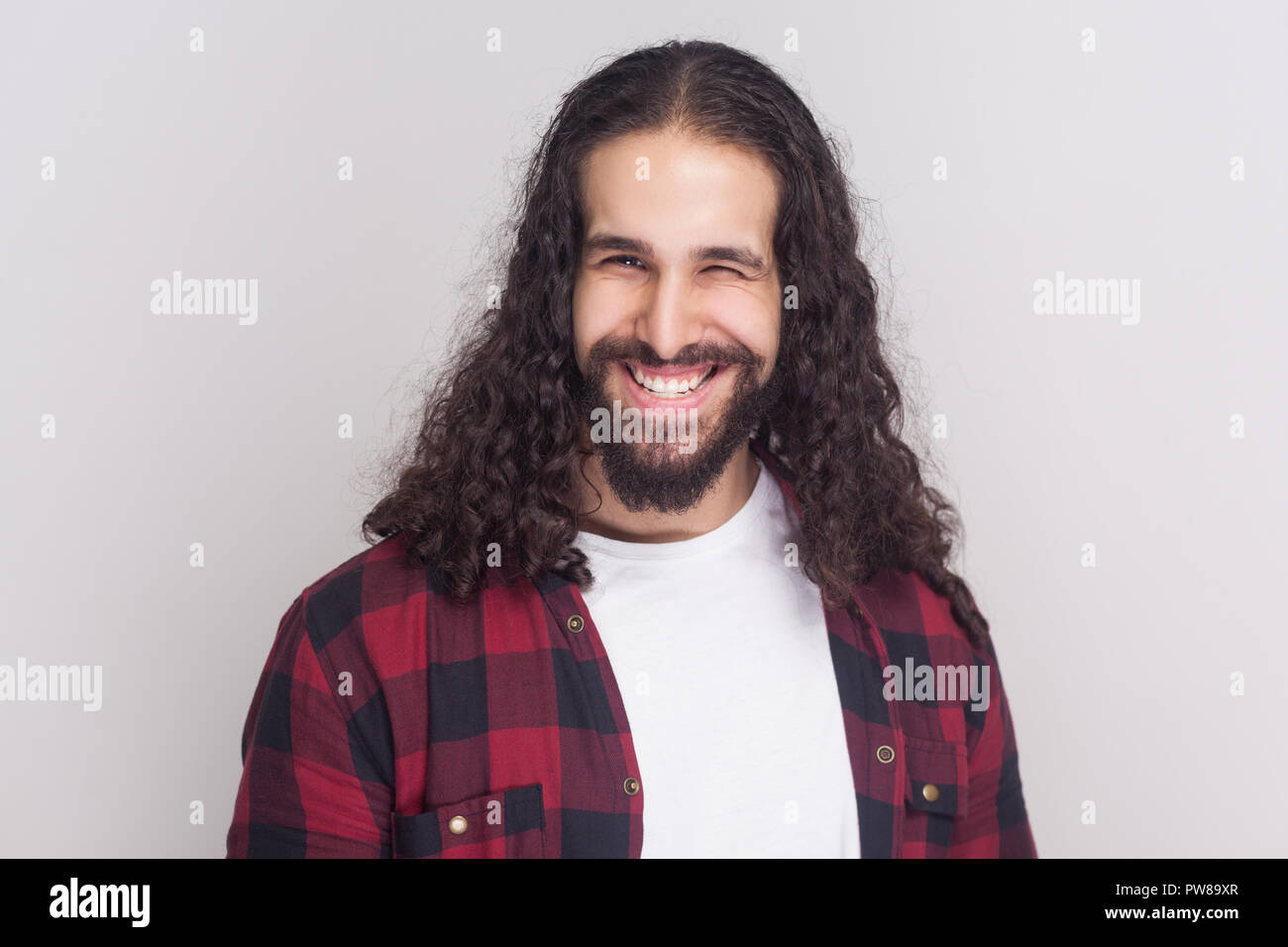 Funny Handsome Man With Beard And Black Long Curly Hair In Casual