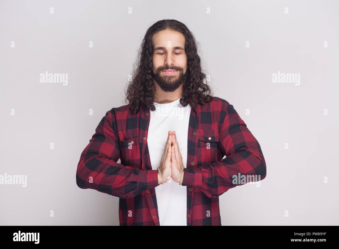 Portrait Of Calm Meditative Handsome Man With Beard And Black Long