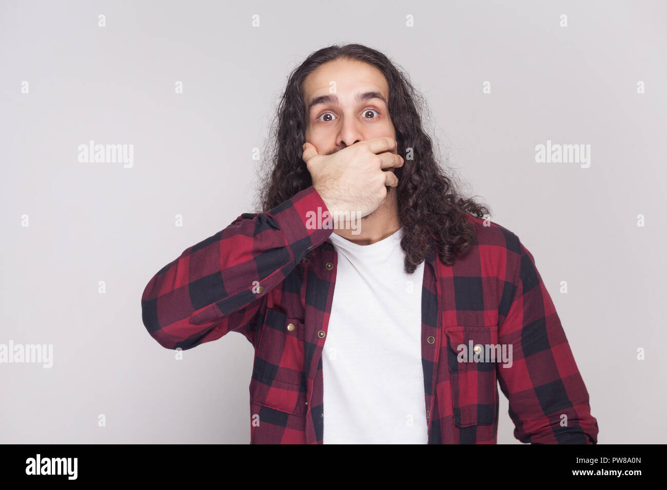 Shocked Handsome Man With Beard And Black Long Curly Hair In