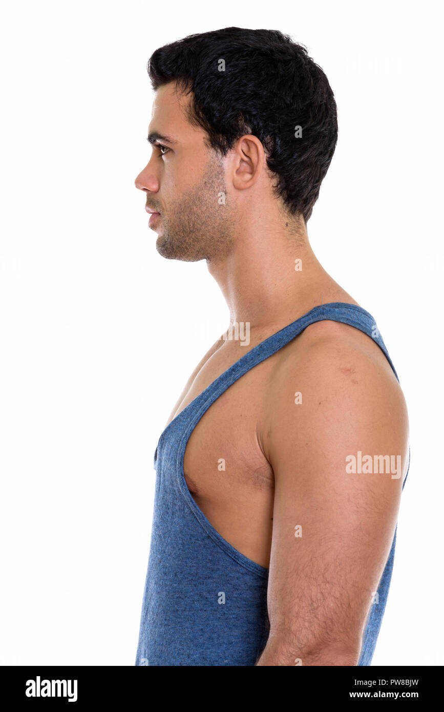 Profile view of young handsome Hispanic man Stock Photo