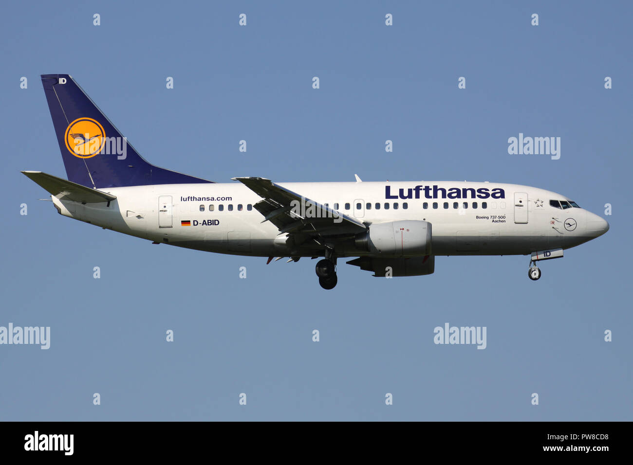 German Lufthansa Boeing 737-500 (old livery) with registration D-ABID on short final for runway 14 of Zurich Airport. Stock Photo