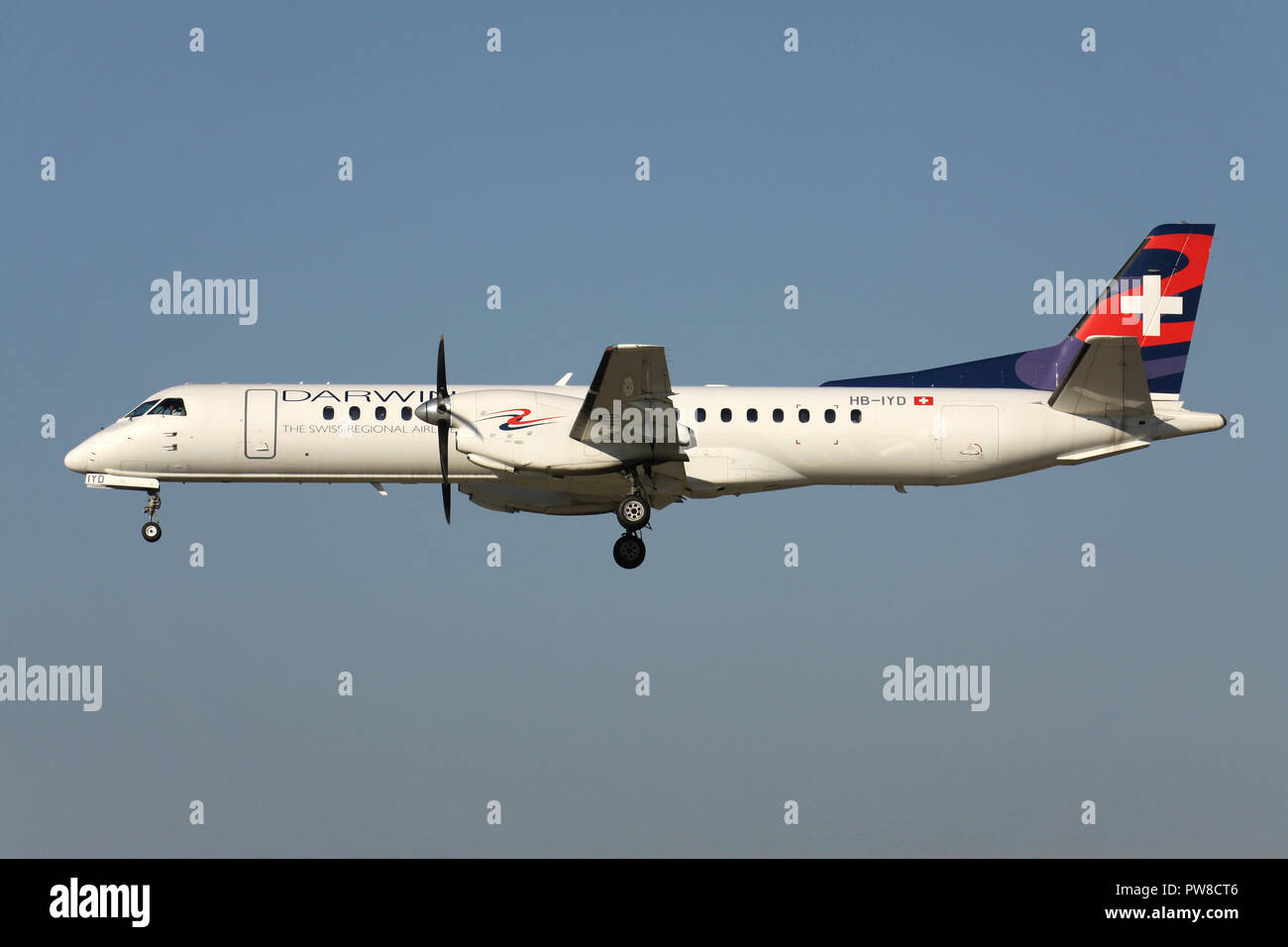 Swiss Darwin Saab 2000 with registration HB-IYD on short final for runway 14 of Zurich Airport. Stock Photo