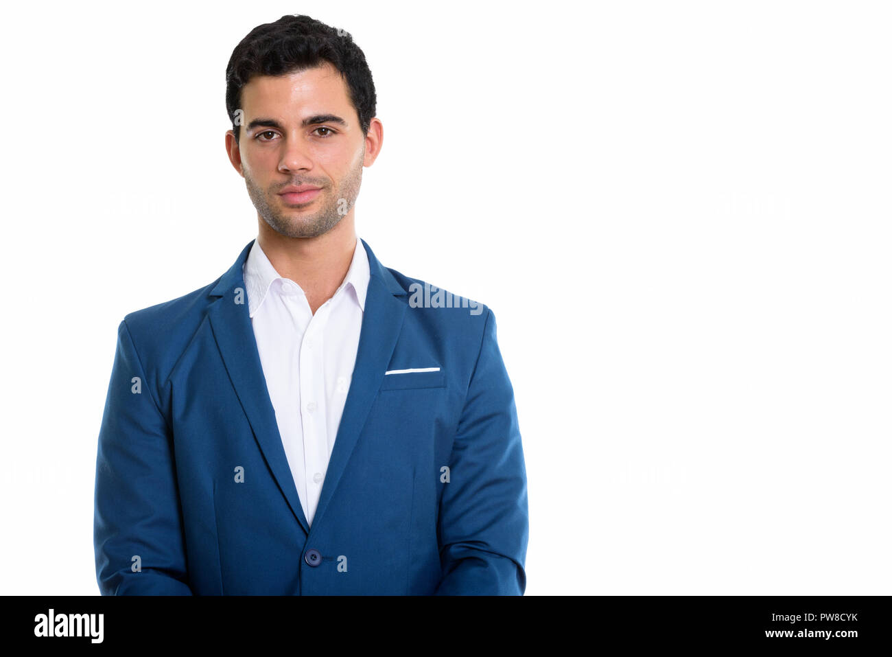 Studio shot of young handsome Hispanic businessman Stock Photo