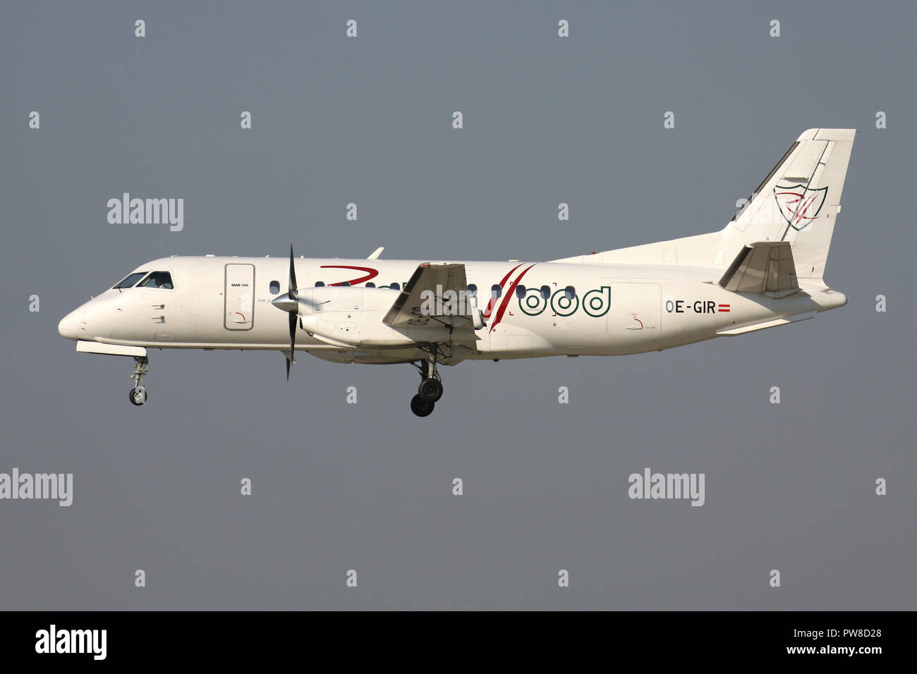 Austrian Robin Hood Saab 340 with registration OE-GIR on short final for runway 14 of Zurich Airport. Stock Photo