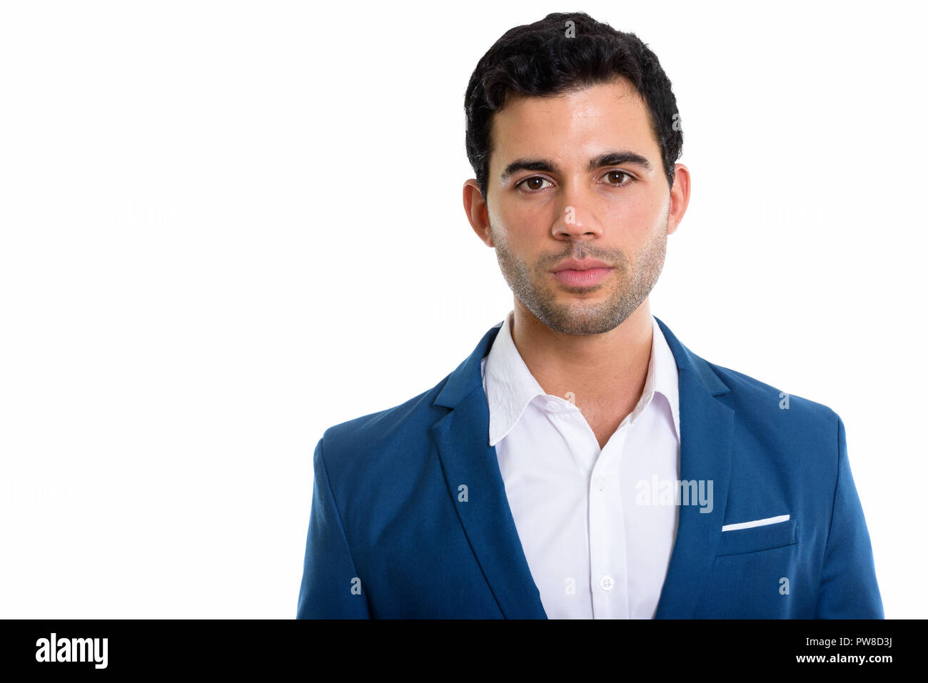 Studio shot of young handsome Hispanic businessman Stock Photo
