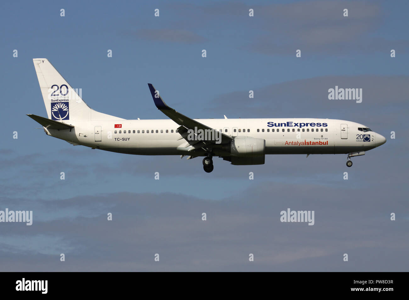 Turkish SunExpress Boeing 737-800 (old livery) with 20 Years stickers) with registration TC-SUY on short final for runway 14 of Zurich Airport. Stock Photo