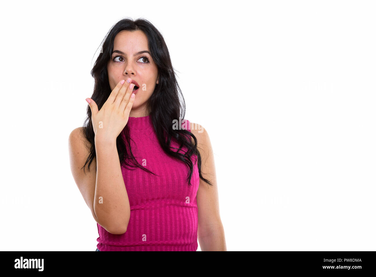 Studio shot of young beautiful Spanish woman thinking while look Stock Photo