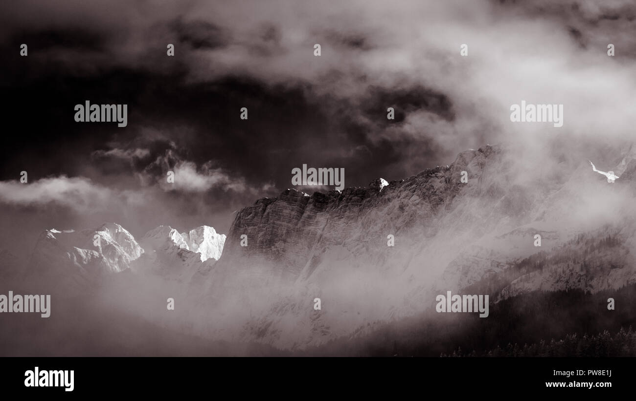 Clouds surrounding the italian alps after the snowfall Stock Photo - Alamy