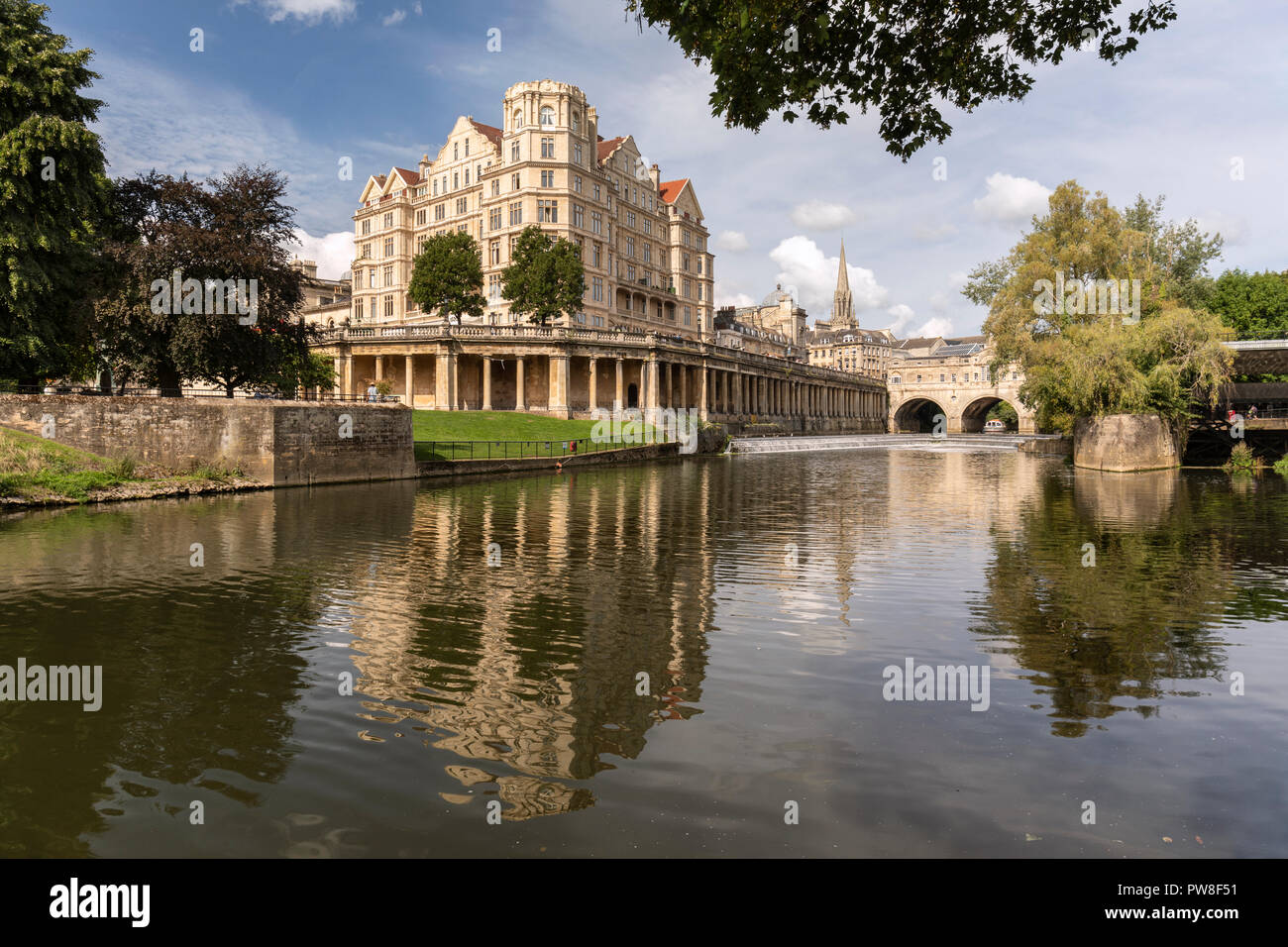 Pulteney Bridge and weir, Grand Parade and riverside vaults all seen with reflections in the River Avon, City of Bath, Somerset, England, UK Stock Photo