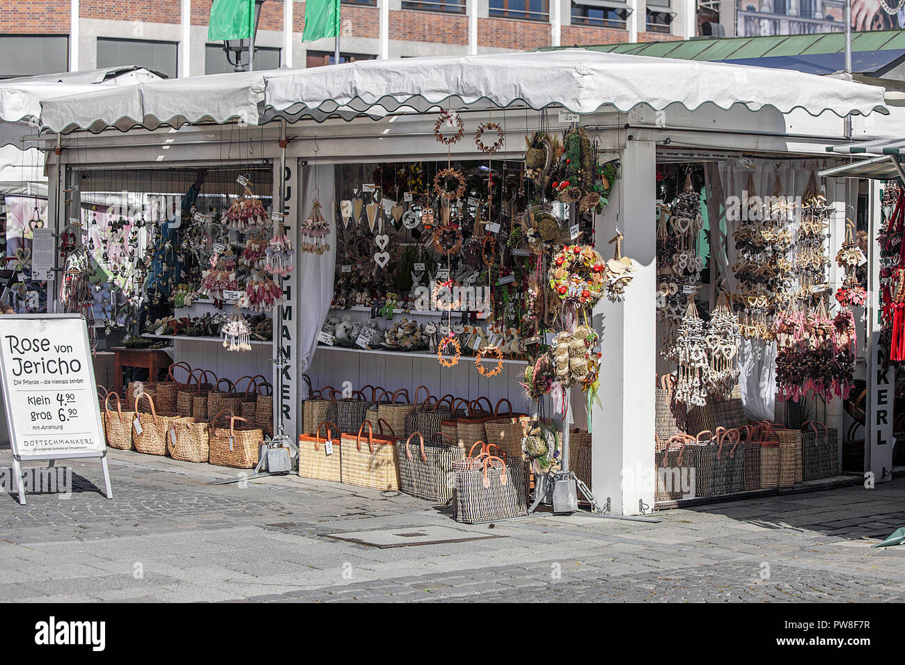 Market stall selling souvenirs in munich hires stock photography and