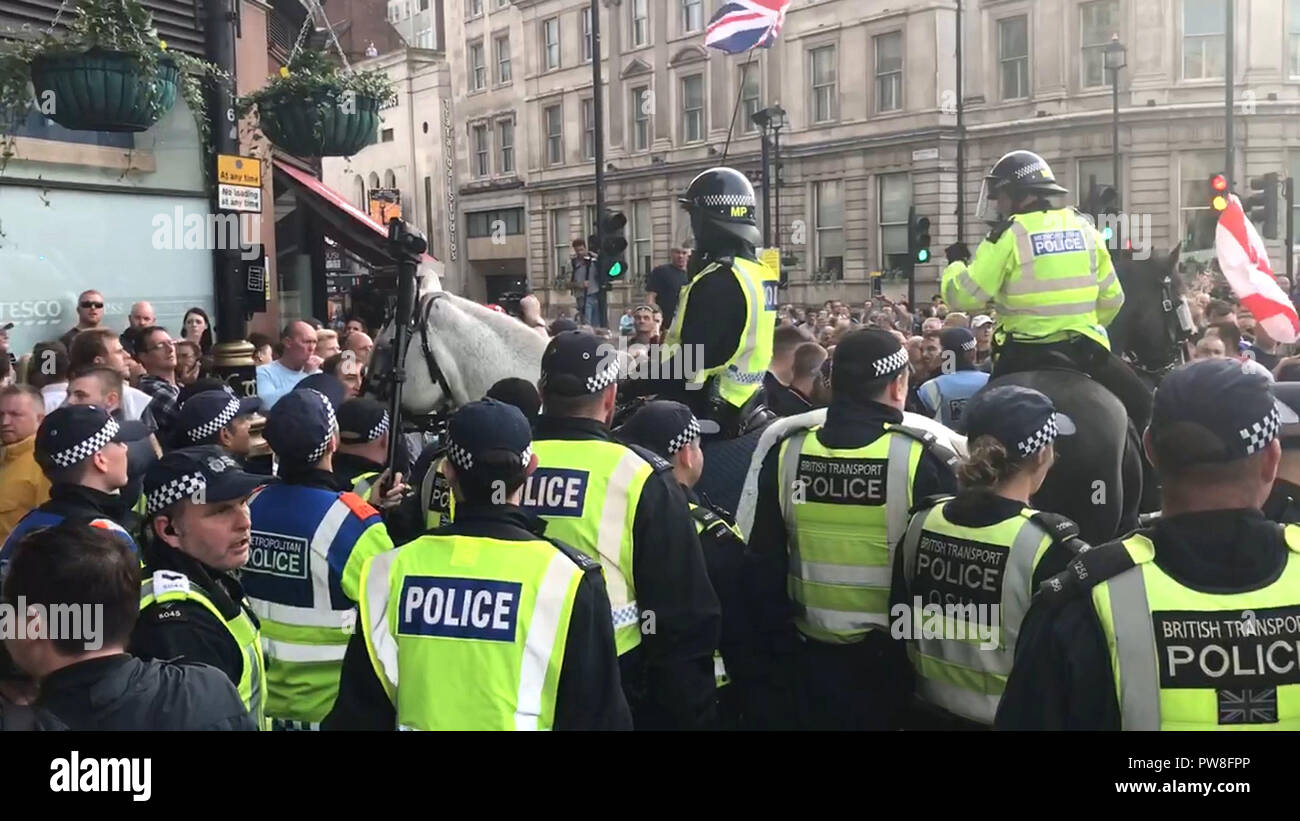 Still photo of a planned silent march by anti-Islam &quot;football lads&quot; group passing through central London, which turned violent after supporters pushed through police escorts and got in fights with officers. Stock Photo