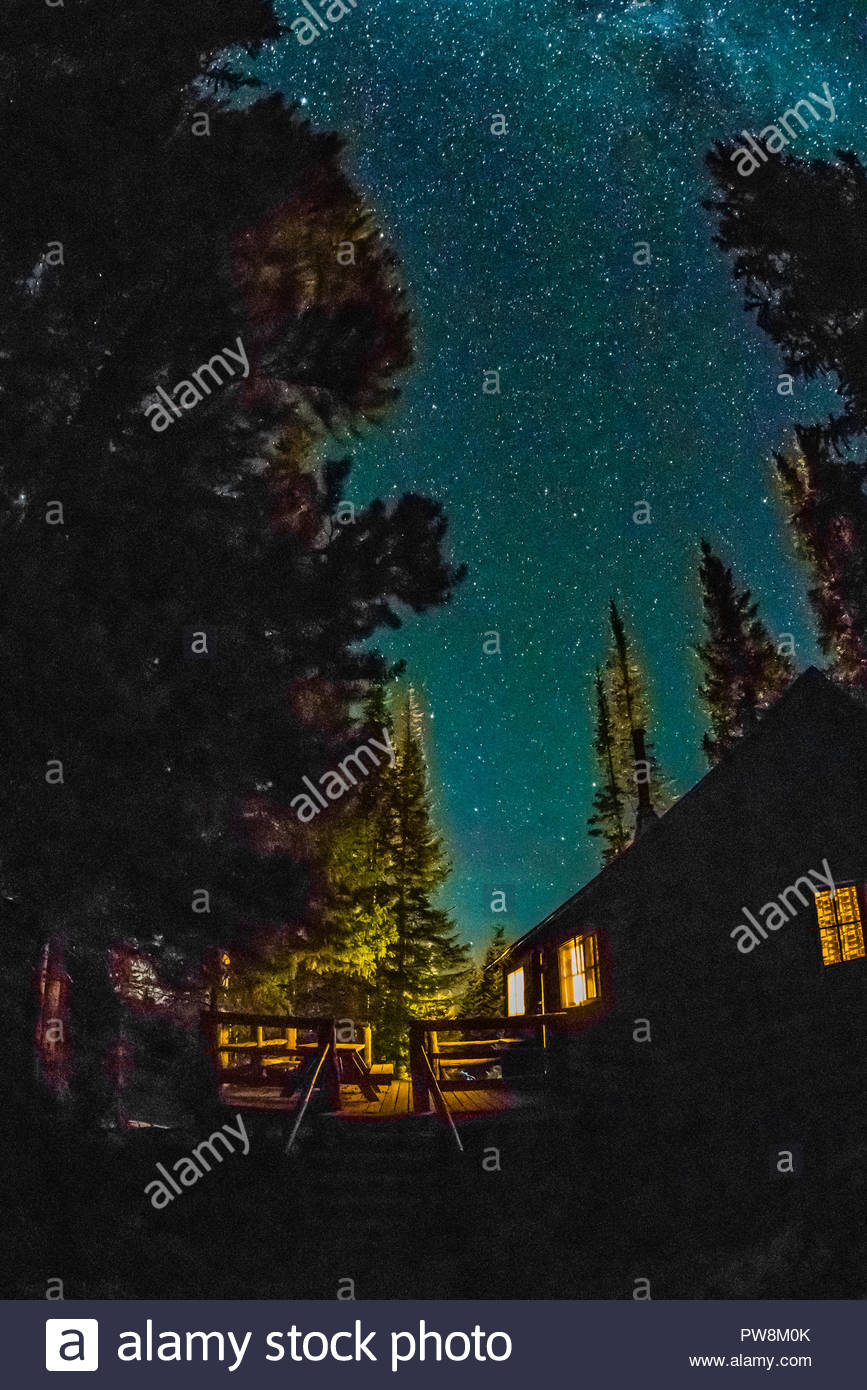 At Night View Of One Of The Cabins At Trappers Lake Lodge With A