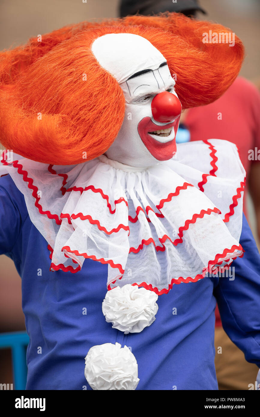 Chicago, Illinois , USA - September 9, 2018 The 26th Street Mexican Independence Parade, Man dress up as bozo the clown dancing on top of a float Stock Photo