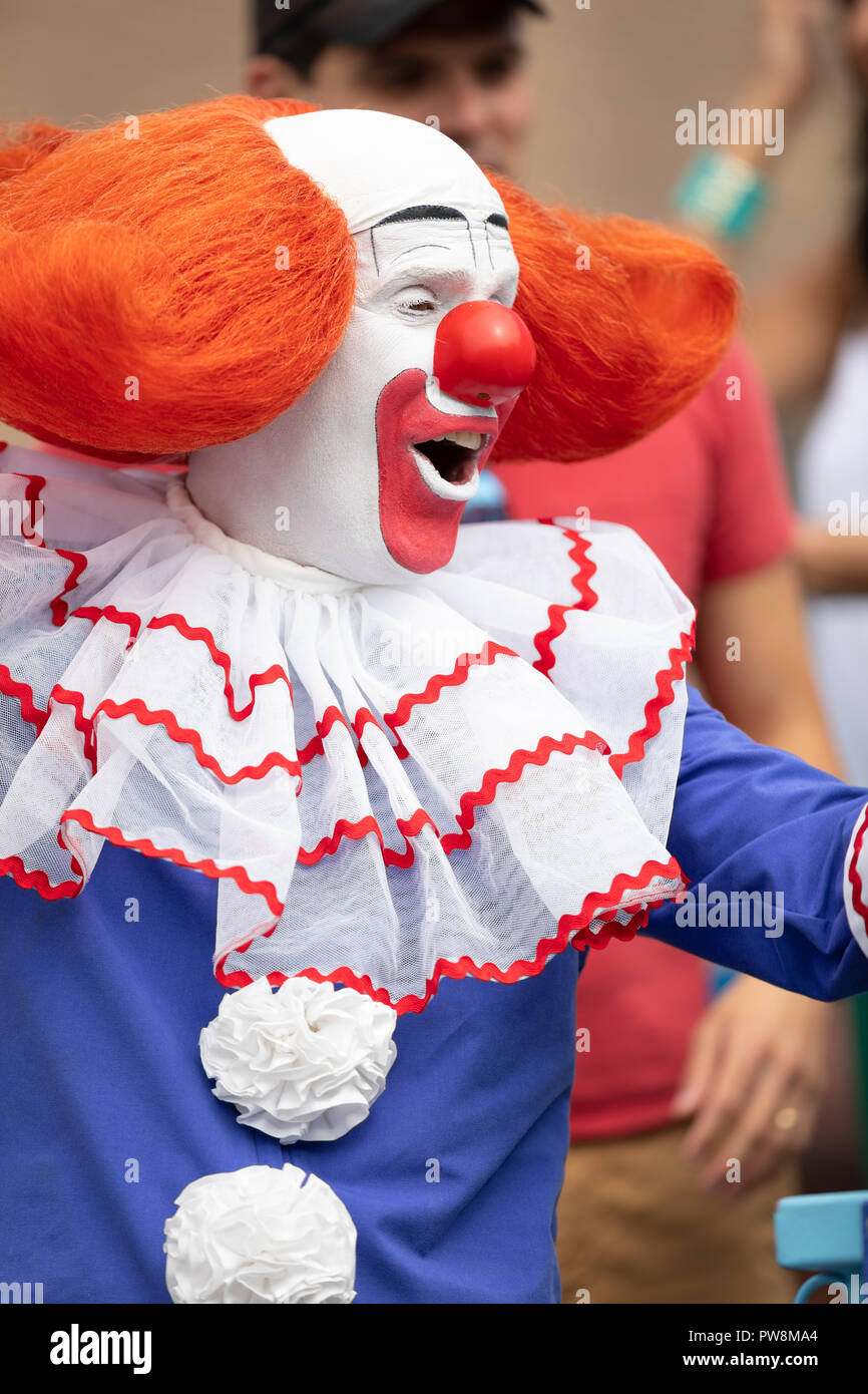 Chicago, Illinois , USA - September 9, 2018 The 26th Street Mexican Independence Parade, Man dress up as bozo the clown dancing on top of a float Stock Photo