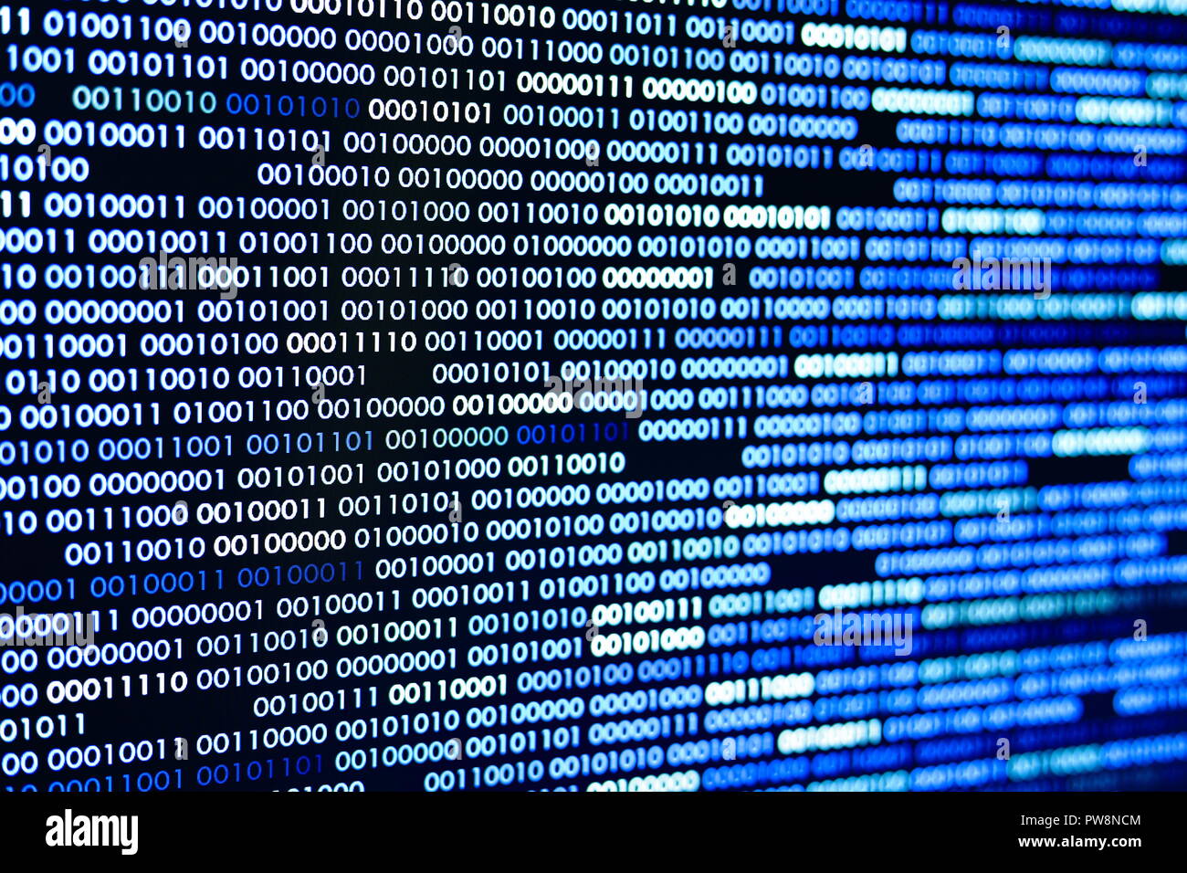 Big overload blockchain data. Blue binary data code background for internet and cyberspace security function. one and zero text on LED moniter screen. Stock Photo