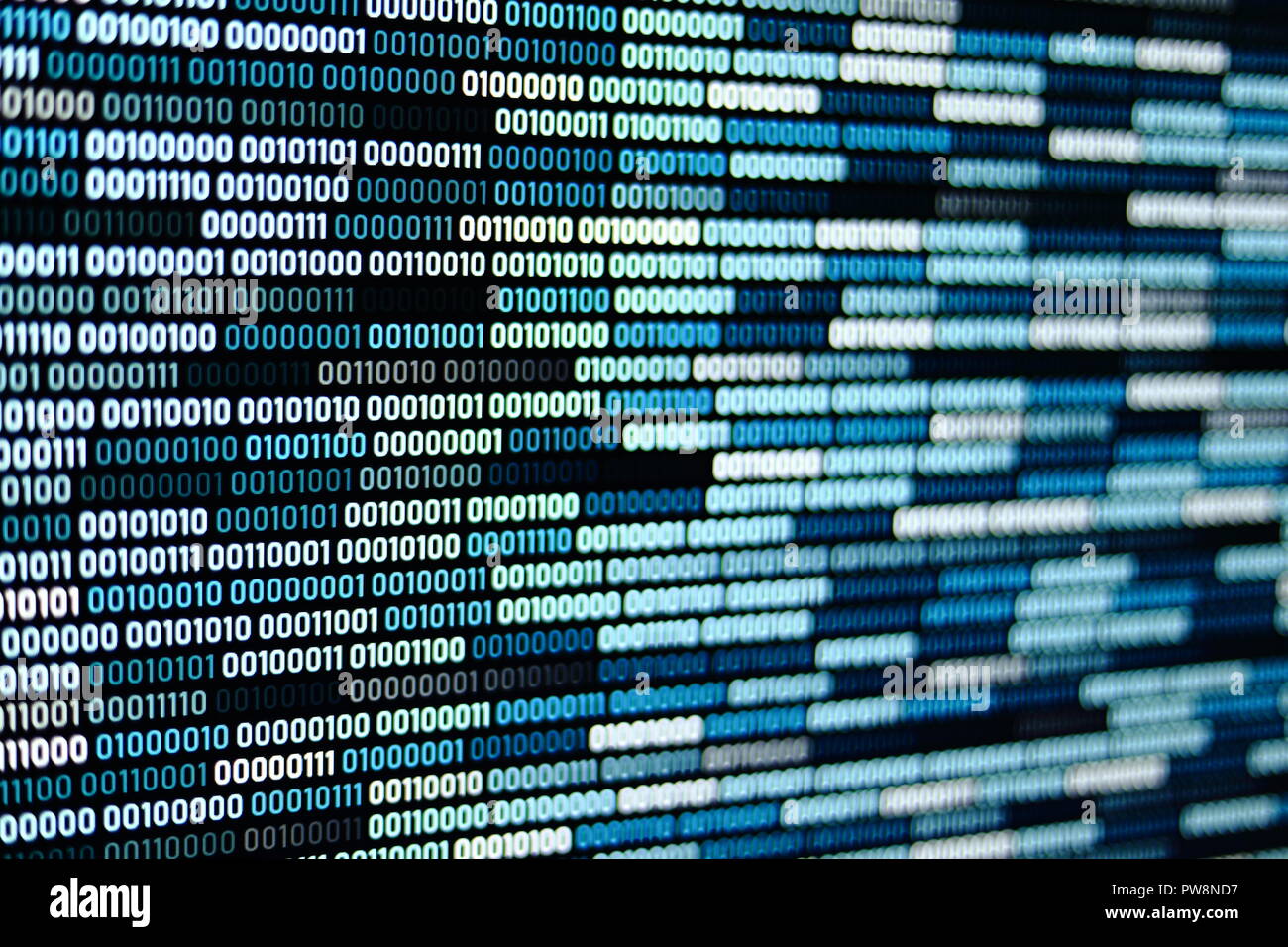 Big overload blockchain data. Blue binary data code background for internet and cyberspace security function. one and zero text on LED moniter screen. Stock Photo