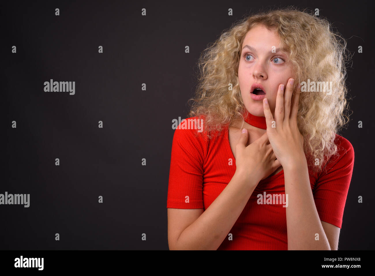 Curly hair woman shocked hi-res stock photography and images - Alamy
