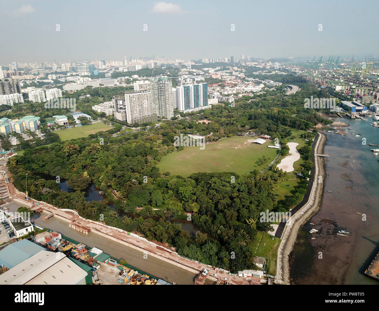 Drone's aerial shot of the whole of West Coast Park, Singapore. A boat
