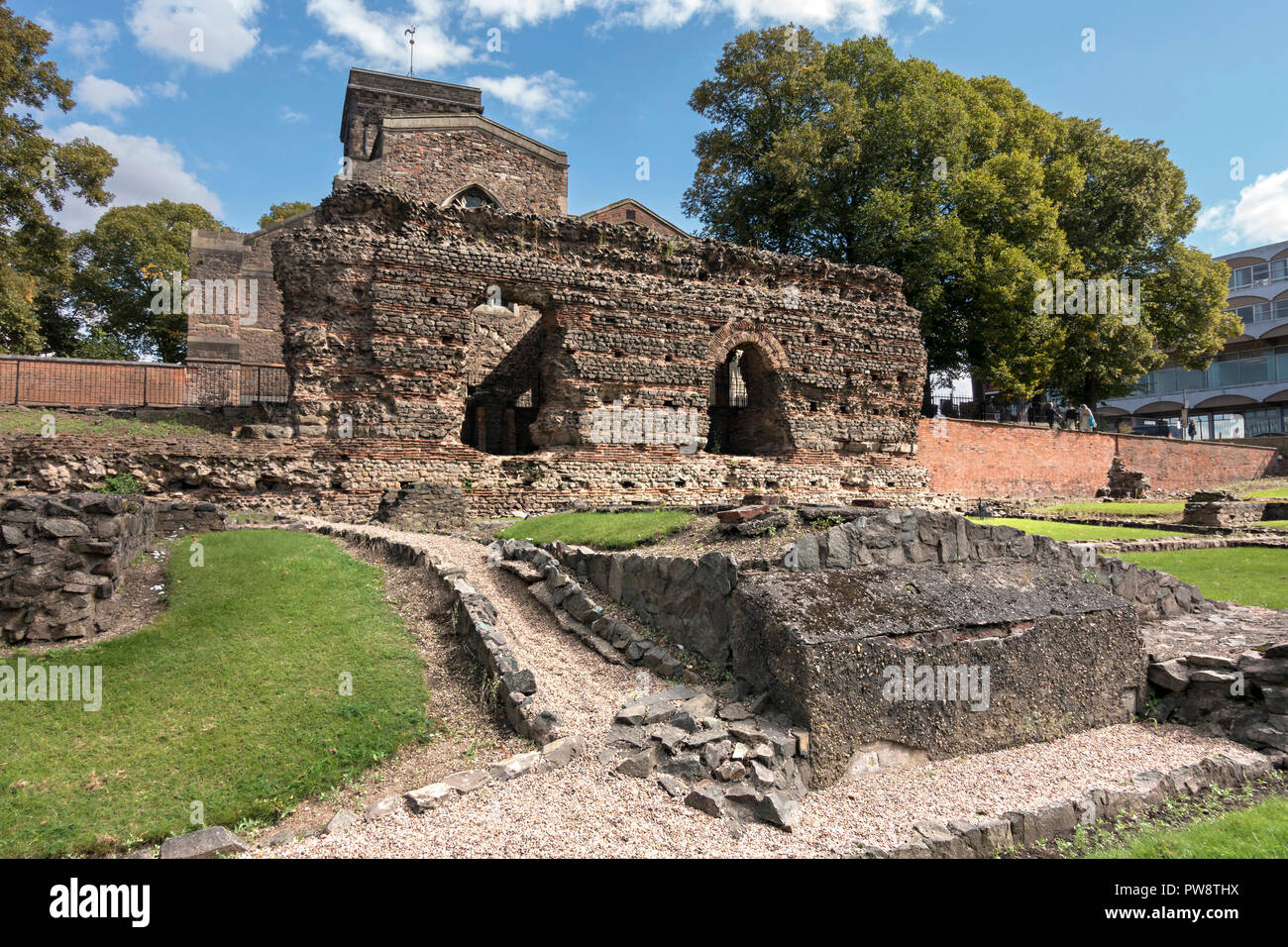 Ruined walls of Roman Baths with St. Nicholas Church behind, Jewry Wall Museum, Leicester, England, UK Stock Photo