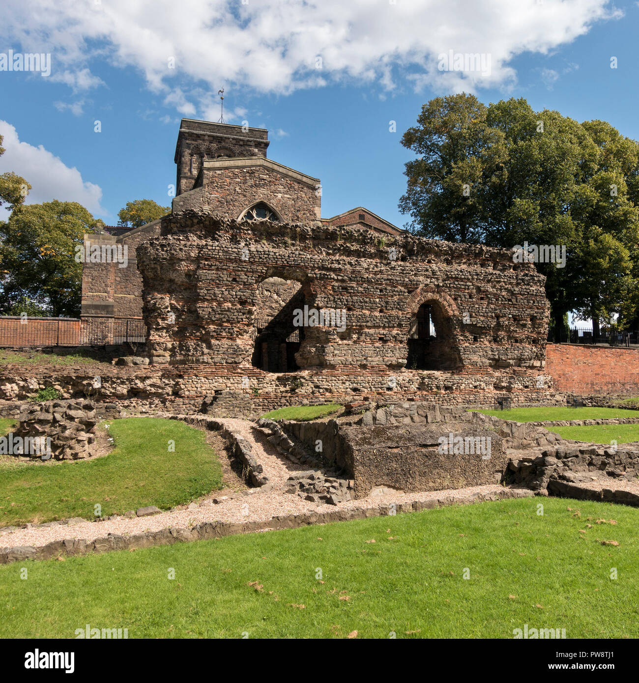 Ruined walls of Roman Baths with St. Nicholas Church behind, Jewry Wall Museum, Leicester, England, UK Stock Photo