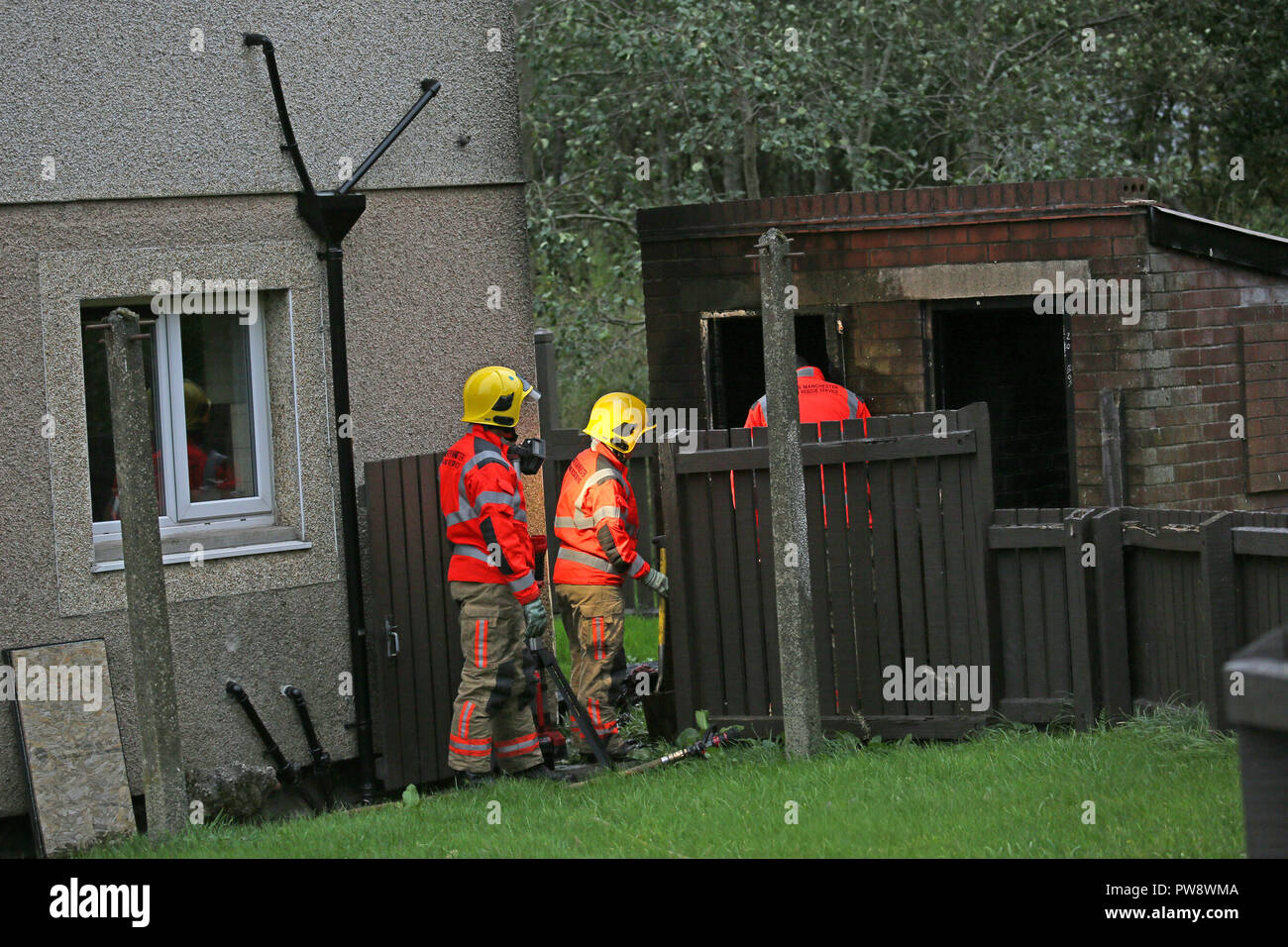 Rochdale, UK. 13th October 2018. Fire and rescue service attend a shed
