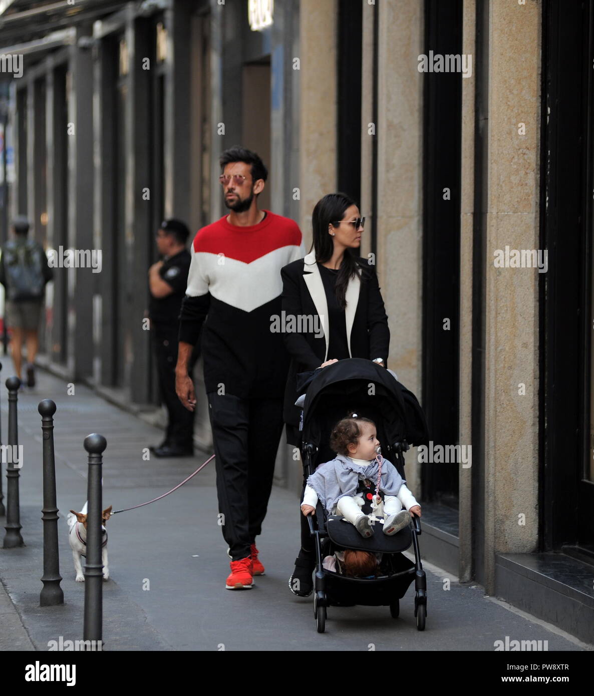 Milan, Nicolas Spolli and family shopping in the center Nicolas Spolli, the Argentine defender of GENOA, arrives in the center with his wife ANGELA and his daughter born a few months ago. After a long walk in Via Montenapoleone decide to enter from the 'IL GUFO' a shop specializing in the sale of clothes for children and babies and shopping. Stock Photo