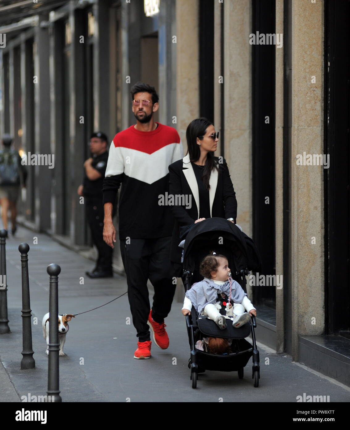 Milan, Nicolas Spolli and family shopping in the center Nicolas Spolli, the Argentine defender of GENOA, arrives in the center with his wife ANGELA and his daughter born a few months ago. After a long walk in Via Montenapoleone decide to enter from the 'IL GUFO' a shop specializing in the sale of clothes for children and babies and shopping. Stock Photo
