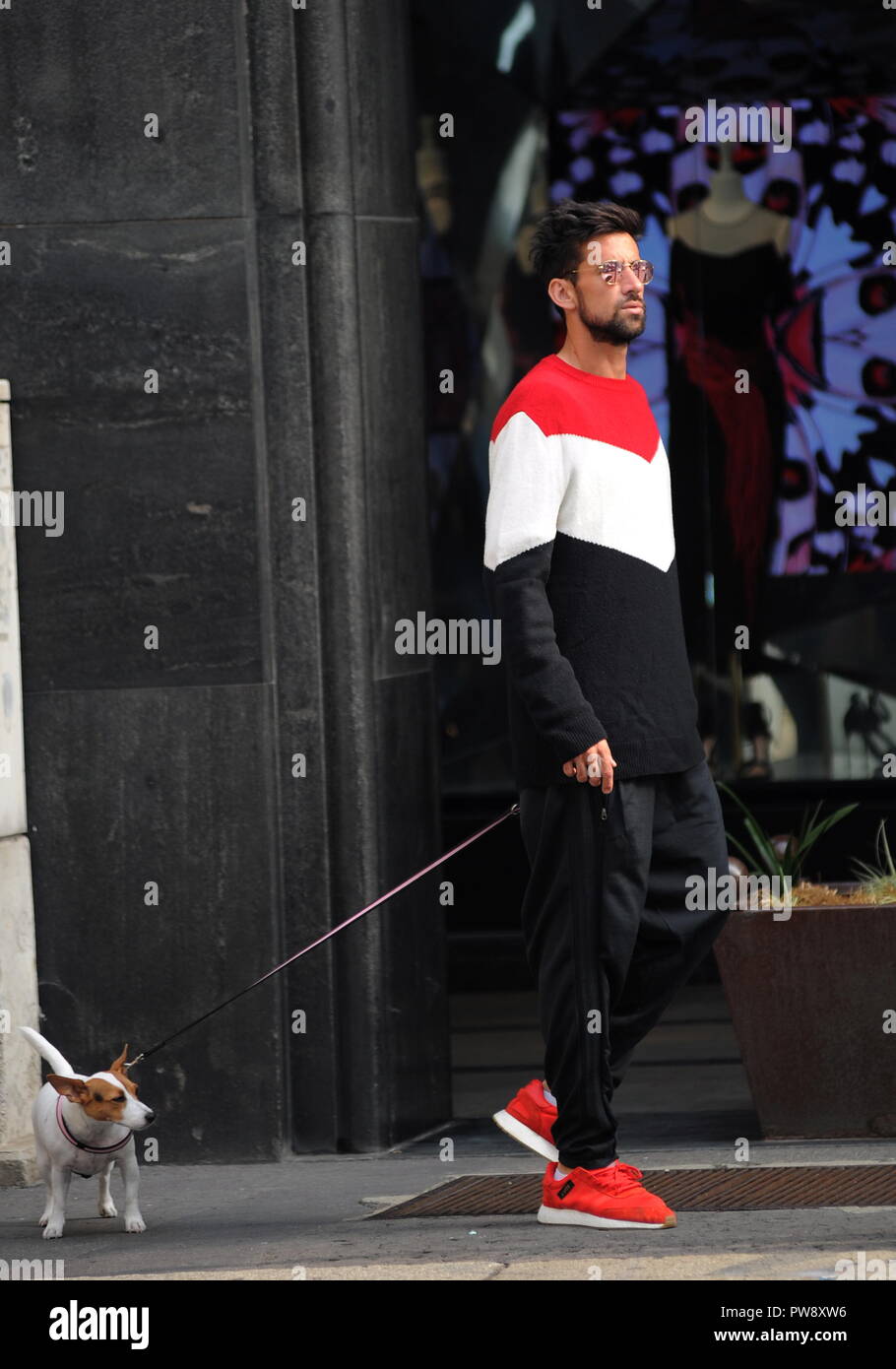 Milan, Nicolas Spolli and family shopping in the center Nicolas Spolli, the Argentine defender of GENOA, arrives in the center with his wife ANGELA and his daughter born a few months ago. After a long walk in Via Montenapoleone decide to enter from the 'IL GUFO' a shop specializing in the sale of clothes for children and babies and shopping. Stock Photo