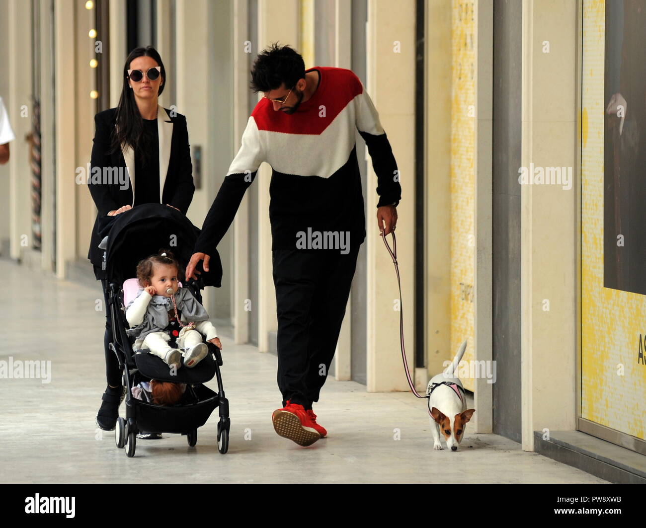 Milan, Nicolas Spolli and family shopping in the center Nicolas Spolli, the Argentine defender of GENOA, arrives in the center with his wife ANGELA and his daughter born a few months ago. After a long walk in Via Montenapoleone decide to enter from the 'IL GUFO' a shop specializing in the sale of clothes for children and babies and shopping. Stock Photo